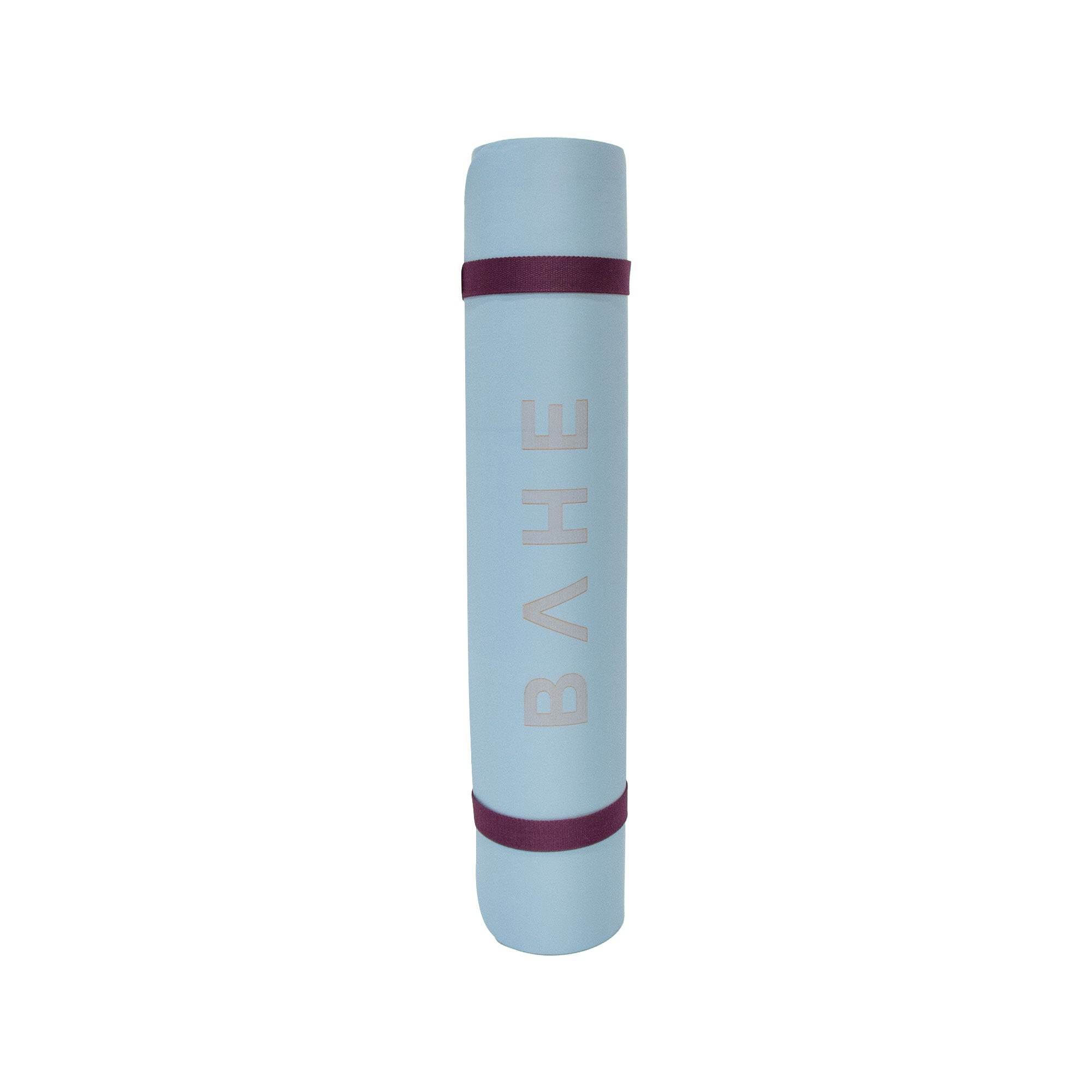 Bahe blue yoga mat rolled up, standing up
