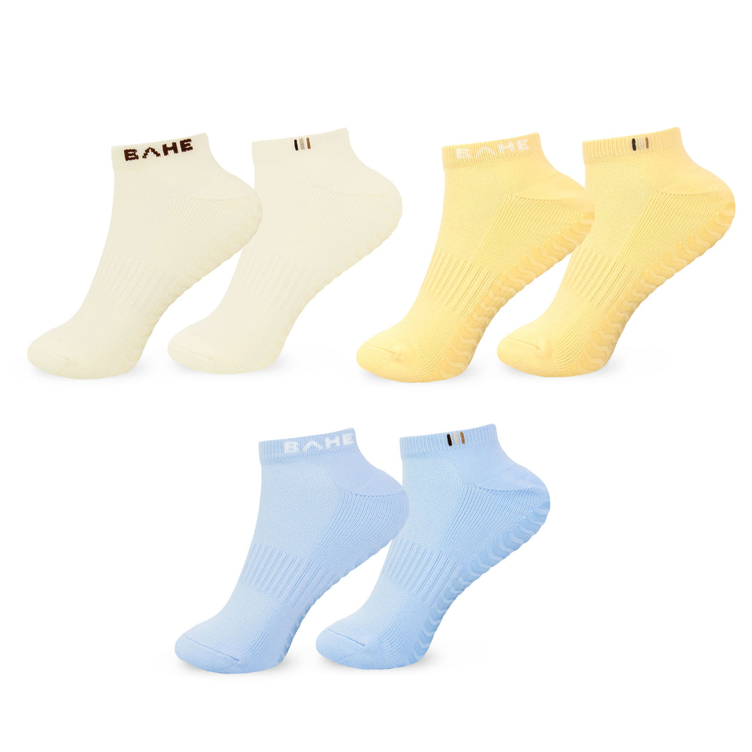 Three pairs of low-cut athletic socks shown on a white background: cream, pale yellow, and light blue. Each pair has the brand name BAHF printed on the front cuff.