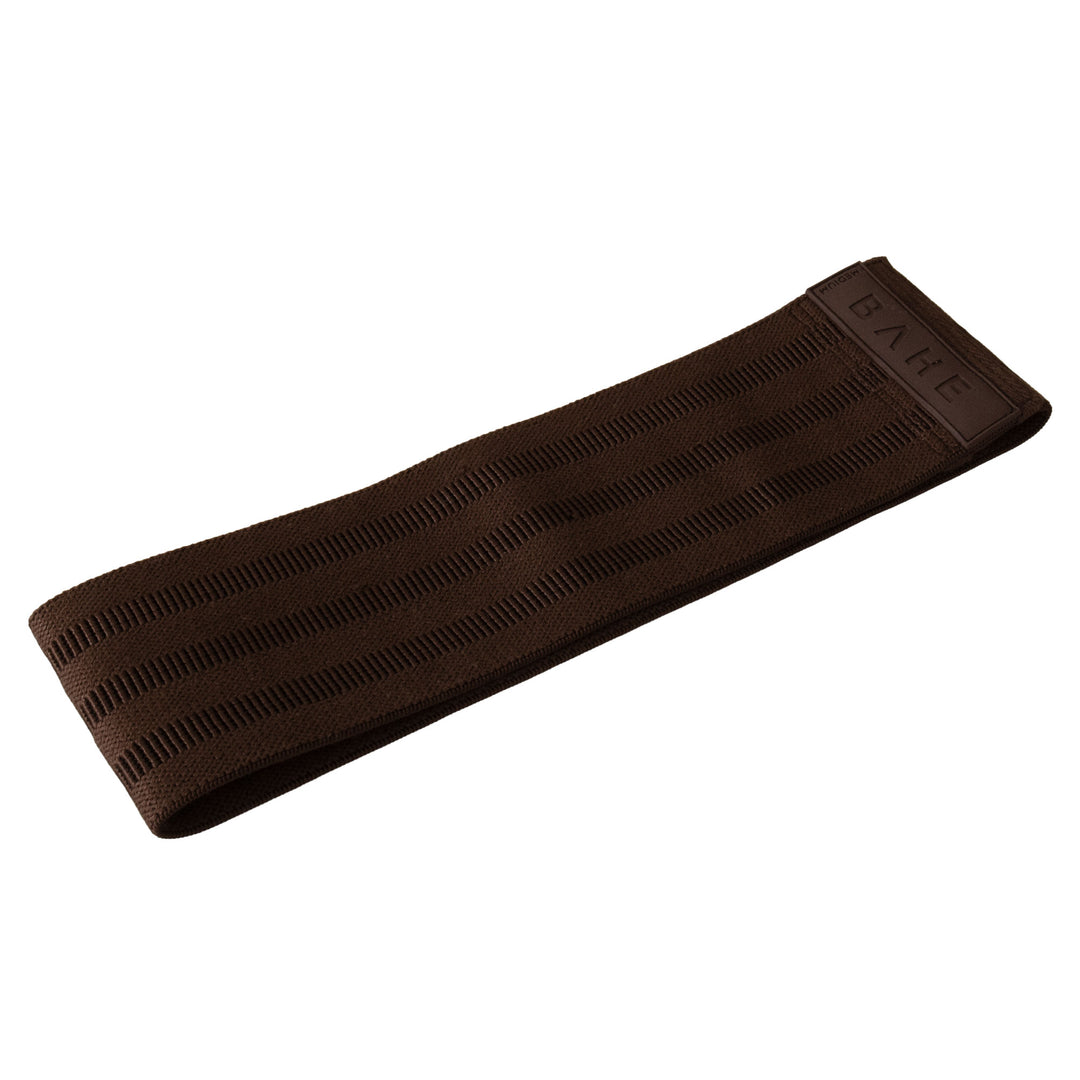 A dark brown textured fabric booty band embossed with the brand name 'BAHE', shown on a plain white background.