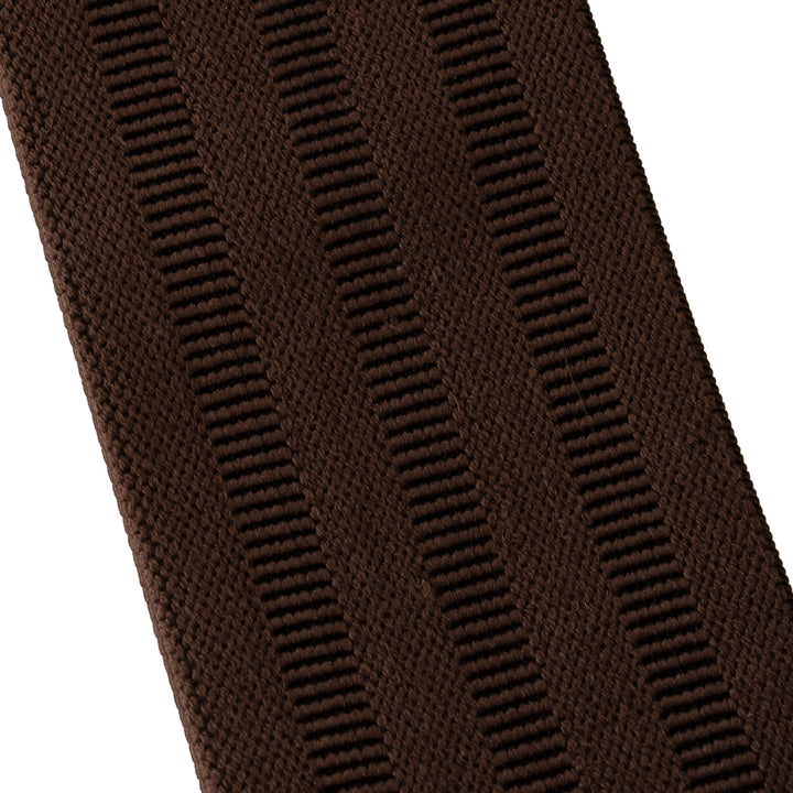A close-up of a dark brown ribbed knit fabric, showing the detailed vertical stripe texture against a white background.