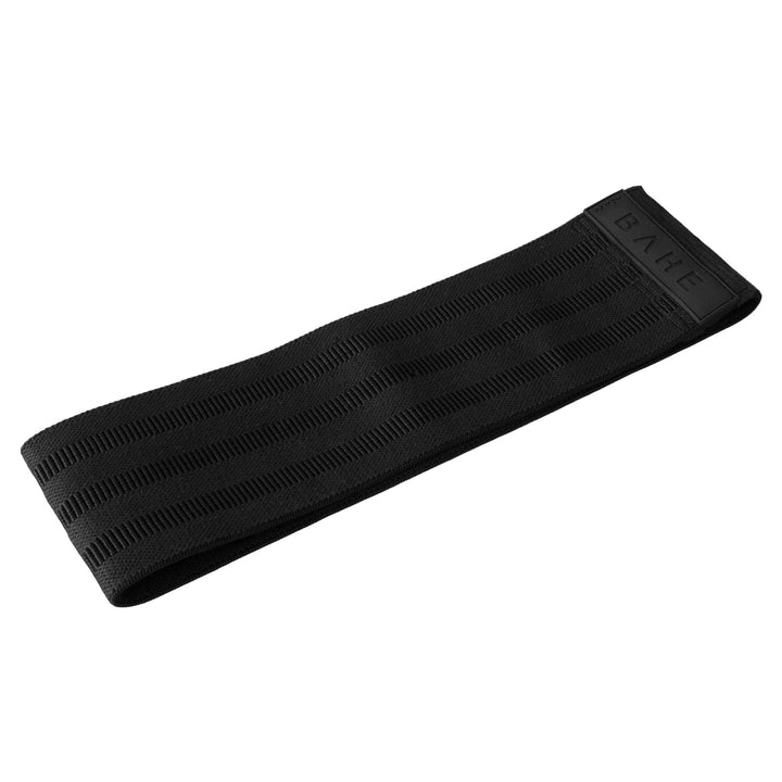 A thick, black athletic booty band with a textured, ribbed pattern and a debossed &